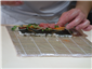 preparing sushi rolls